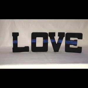 LOVE block letters with a thin blue glitter line💙